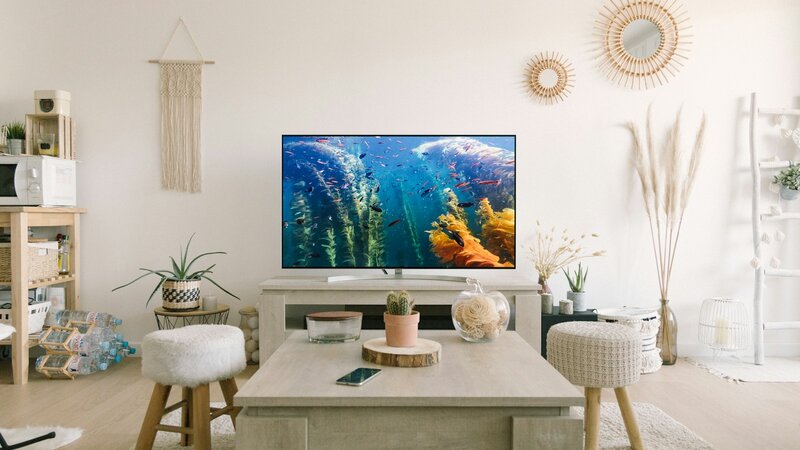Television turned on in a bright modern living room